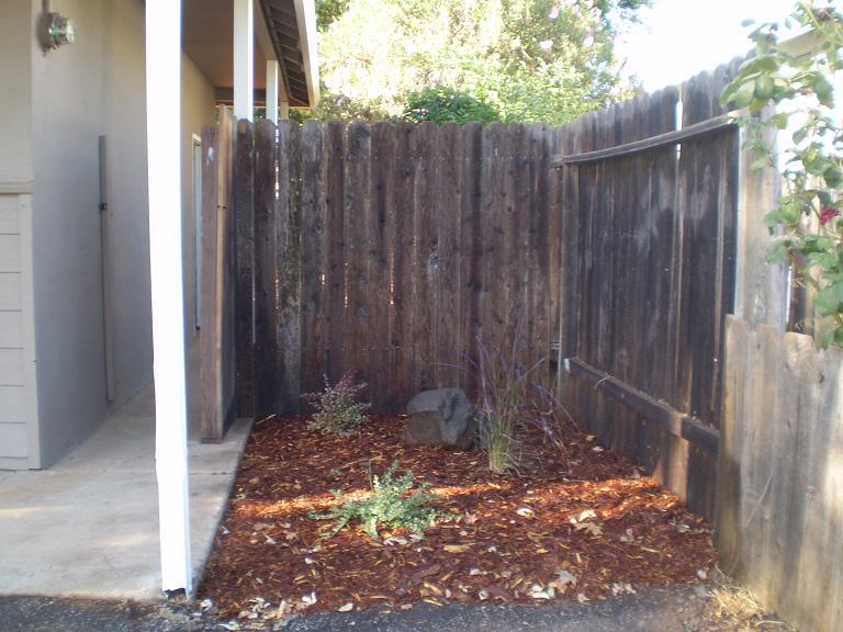 1013 Layton Road Redding, CA 96002 - Photo 2 of 15 a view of small yard with wooden fence