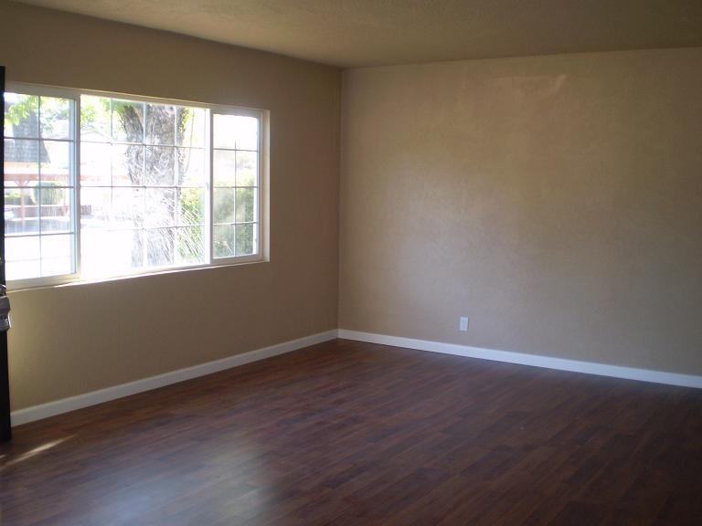 1013 Layton Road Redding, CA 96002 - Photo 7 of 15 an empty room with wooden floor and windows
