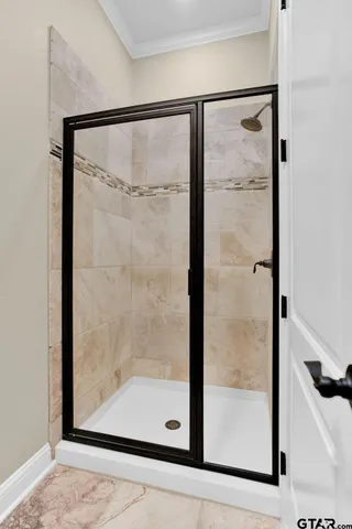 a large white bathroom with a bathtub sink and mirror