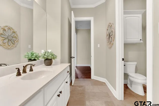 a bathroom with a bathtub sink and mirror