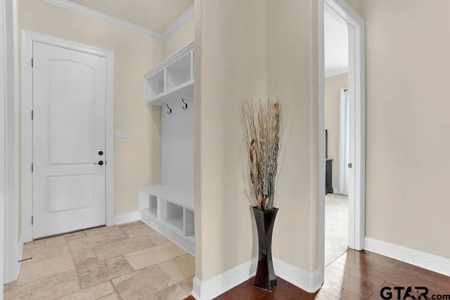 a spacious bathroom with a double vanity sink a mirror a bathtub and a shower