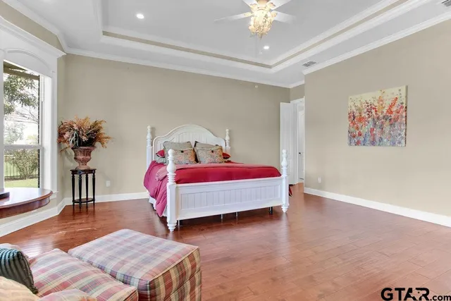 a group of people sitting in front of a house