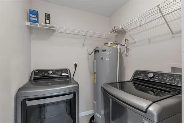 a stove top oven sitting inside of a kitchen