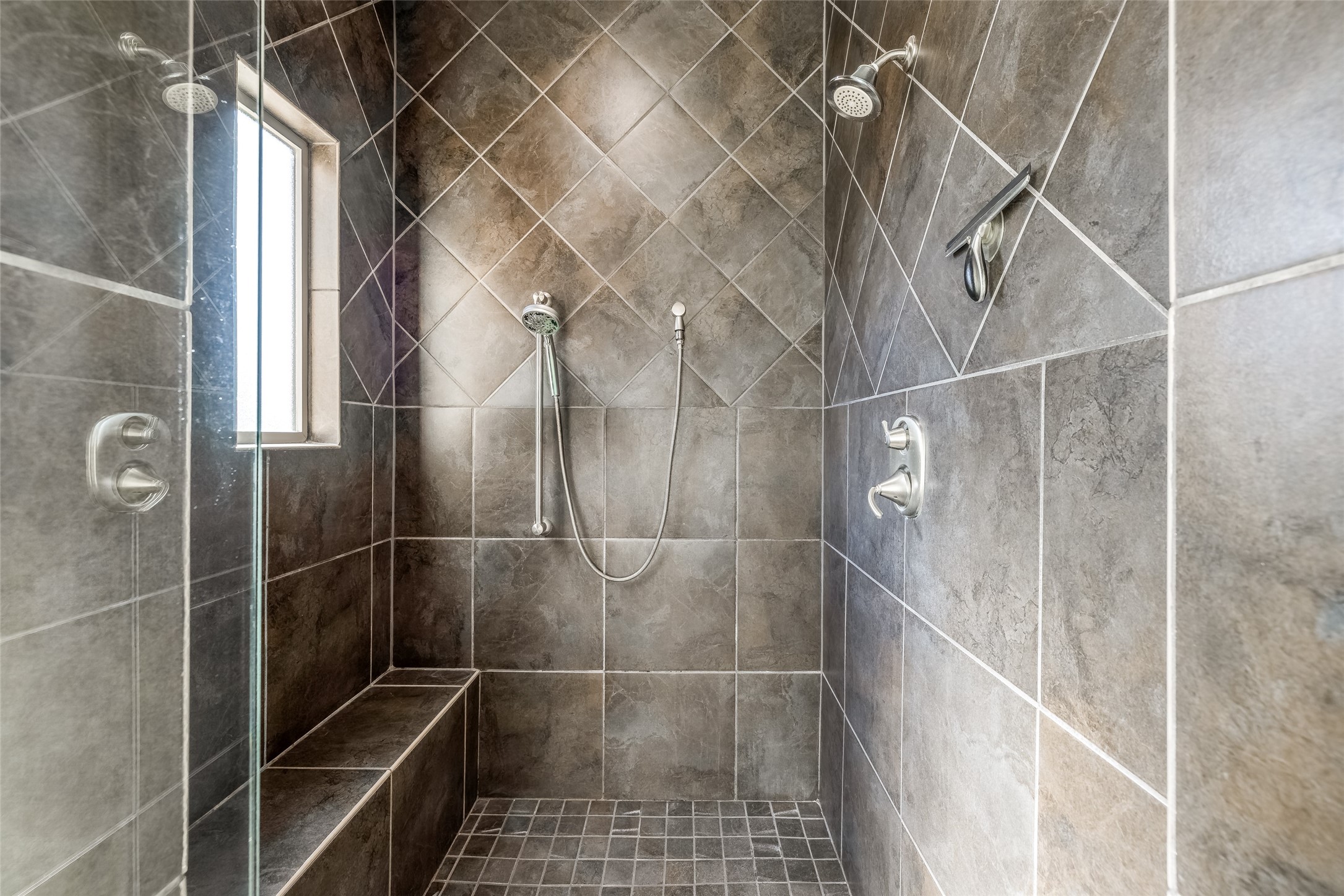 31102 Lower Oxbow Trace Fulshear, TX 77441 - Photo 24 of 50 Fabulous large tiled shower with natural light, shower head & hand held