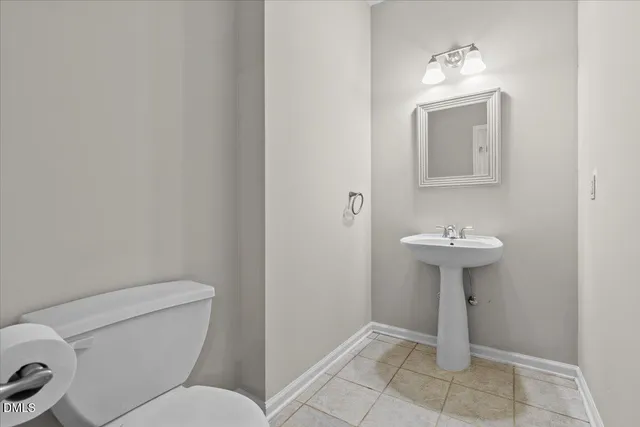 a bathroom with a sink toilet