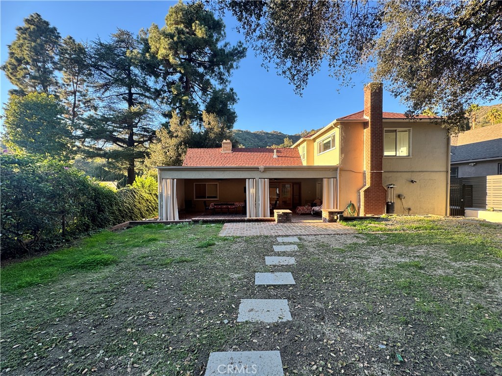 2248 East Chevy Chase Drive Glendale, CA 91206 - Photo 12 of 25 a front view of a house with garden