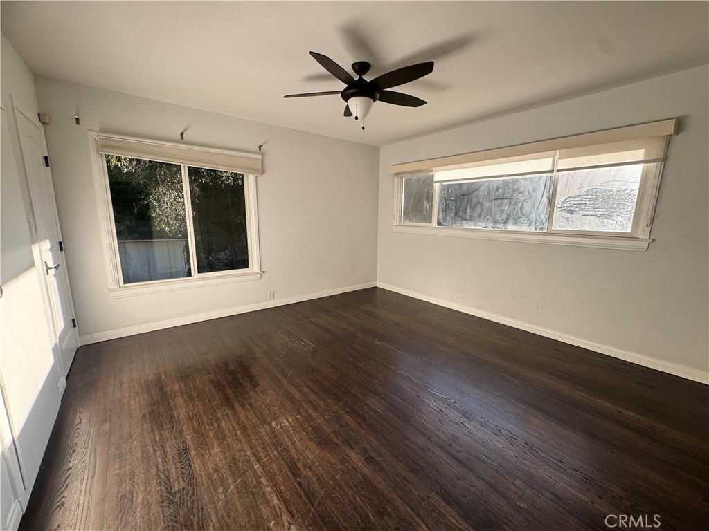 2248 East Chevy Chase Drive Glendale, CA 91206 - Photo 16 of 25 a view of an empty room with wooden floor and a window