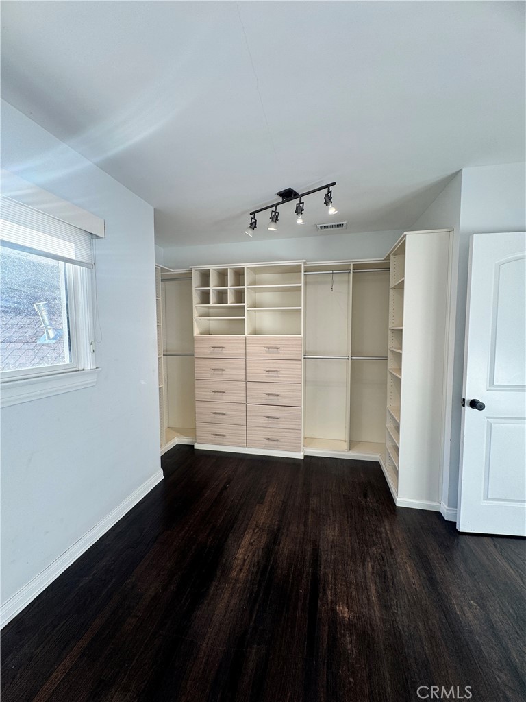 2248 East Chevy Chase Drive Glendale, CA 91206 - Photo 20 of 25 a view of an empty room with a window and wooden floor