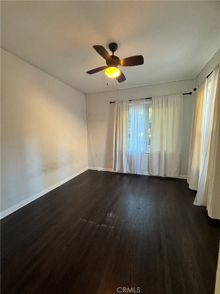 2248 East Chevy Chase Drive Glendale, CA 91206 - Photo 24 of 25 an empty room with wooden floor and windows
