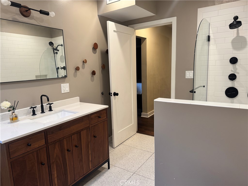 2248 East Chevy Chase Drive Glendale, CA 91206 - Photo 6 of 25 a spacious bathroom with double vanity and mirrors