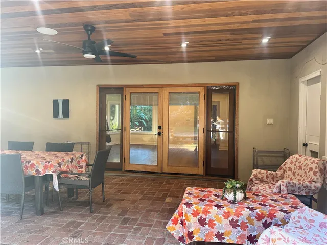 a bedroom with a bed and glass door