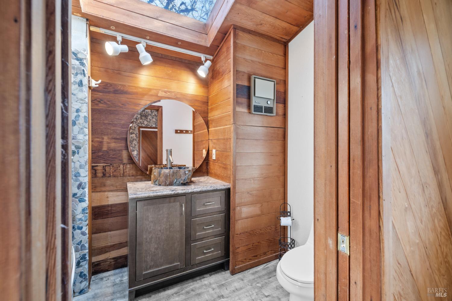 9105 Loch Haven Drive Santa Rosa, CA 95404 - Photo 32 of 62 a bathroom with a sink and a mirror