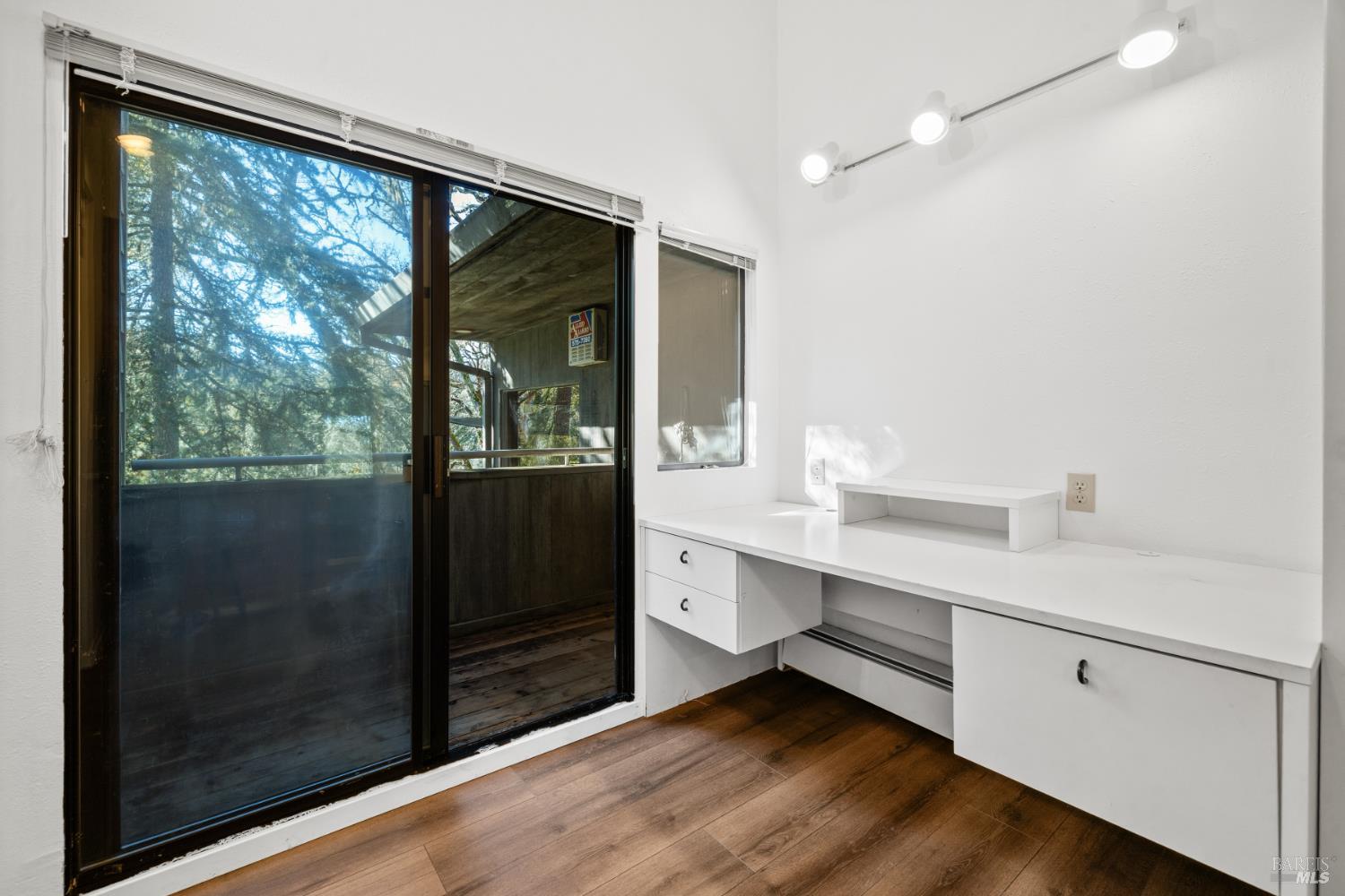 9105 Loch Haven Drive Santa Rosa, CA 95404 - Photo 55 of 62 a room with walk in closet and wooden floor