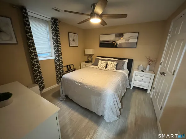 a bedroom with a bed and a table