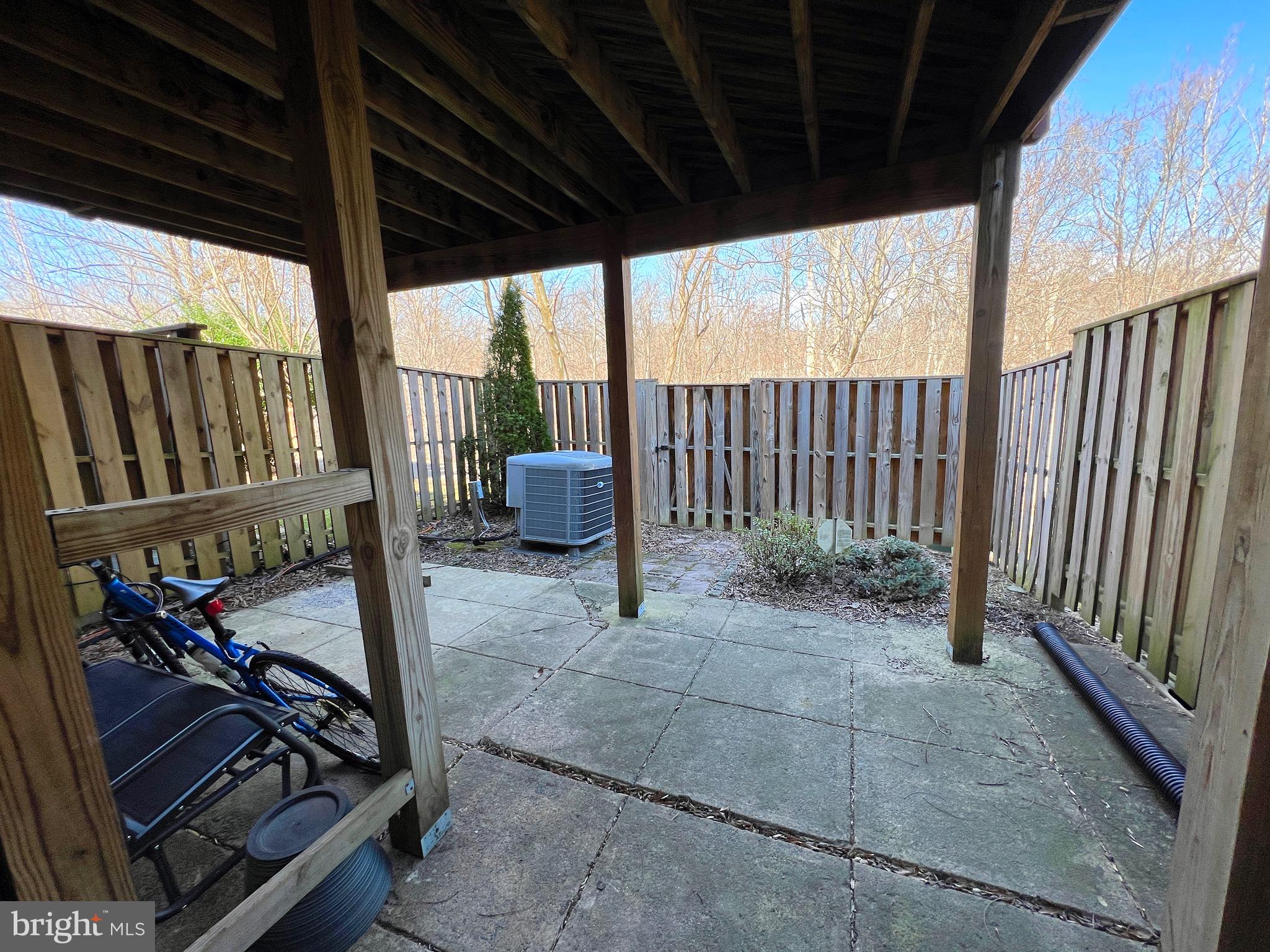 1610 Valencia Way Reston, VA 20190 - Photo 17 of 19 Fully-fenced backyard with stone patio