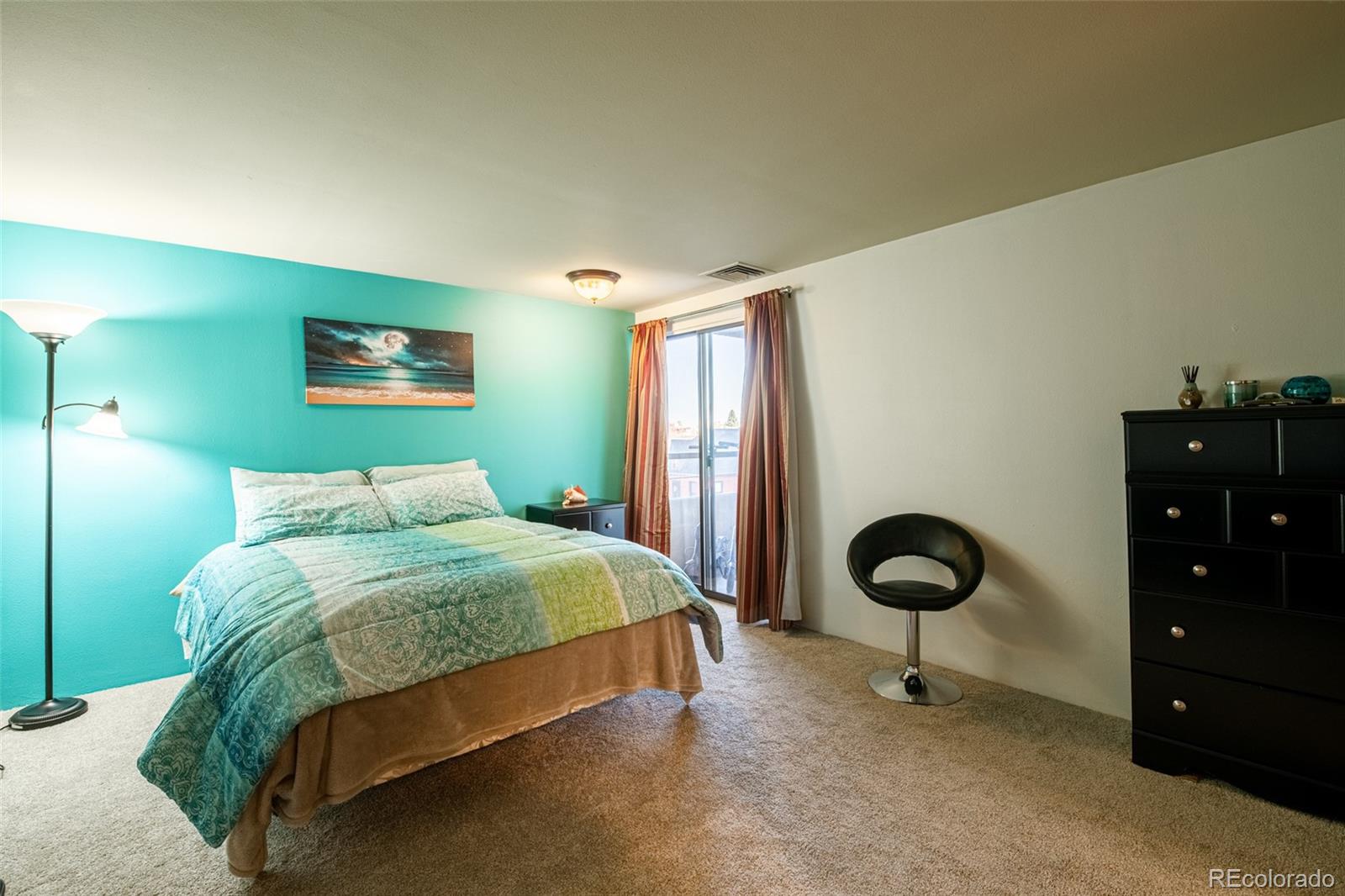 800 North Pearl Street, Unit 403 Denver, CO 80203 - Photo 15 of 36 a bedroom with a bed and a chandelier