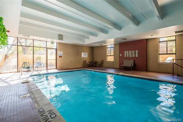 a living room with hard wood flooring and a couch