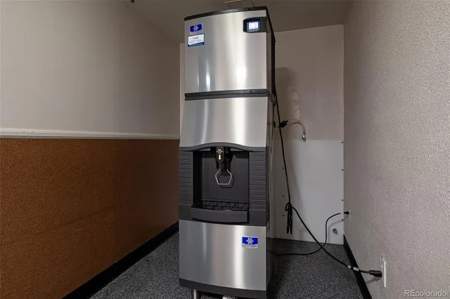 a kitchen with a refrigerator and washer