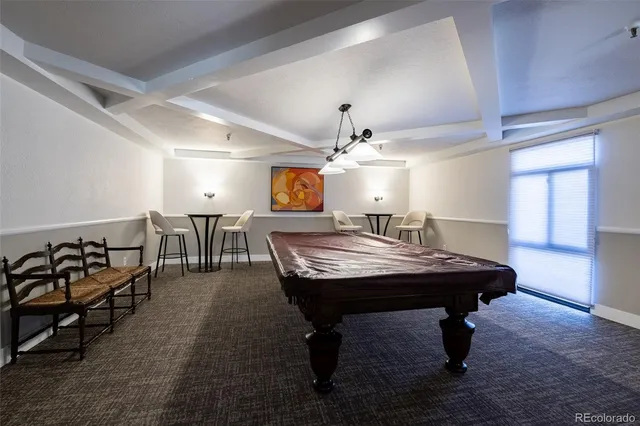 a view of a room with furniture and wooden floor