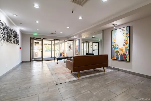 a lobby with furniture and window