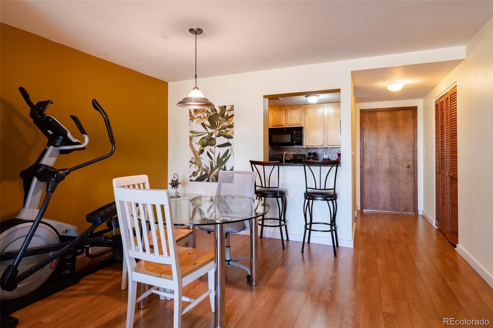 800 North Pearl Street, Unit 403 Denver, CO 80203 - Photo 7 of 36 a dining room with furniture and wooden floor