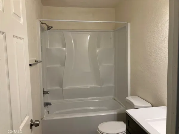 a bathroom with a shower and a bathtub