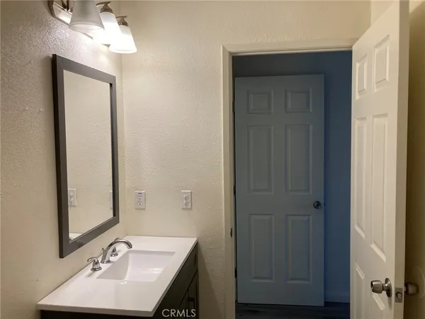 a bathroom with a sink a mirror and a shower