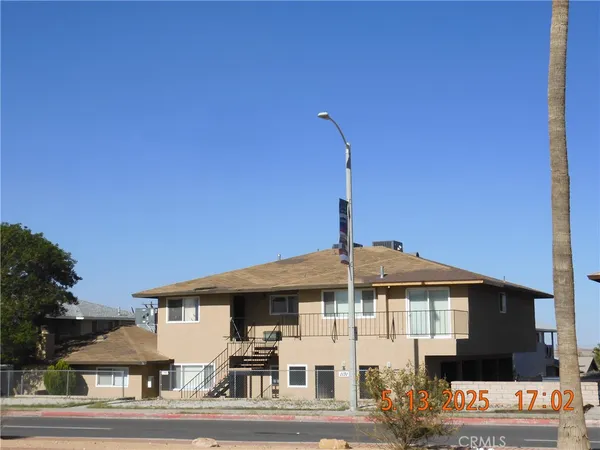a front view of a house with a outdoor space