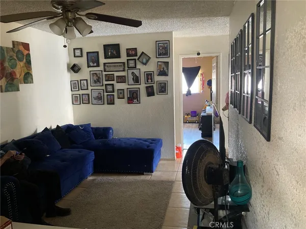 a living room with furniture and a mirror