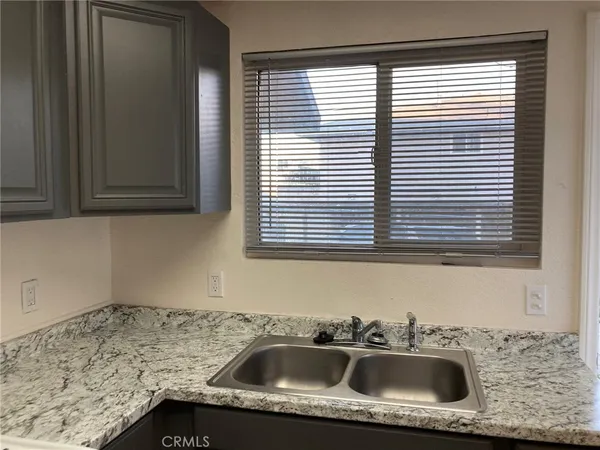 a bathroom with a sink and a window