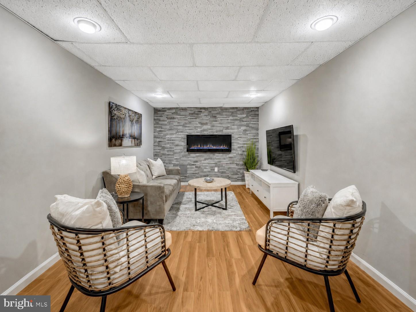 7809 Roundabout Way Springfield, VA 22153 - Photo 58 of 83 Cozy TV zone with electric fireplace