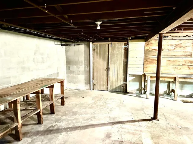 a view of a porch with wooden floor and outdoor seating