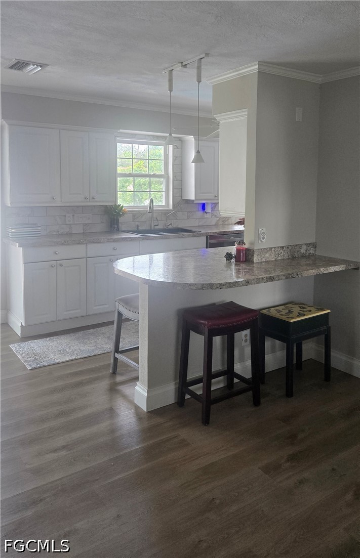 8093 Anhinga Road Fort Myers, FL 33967 - Photo 11 of 49 a kitchen with a table chairs sink and cabinets