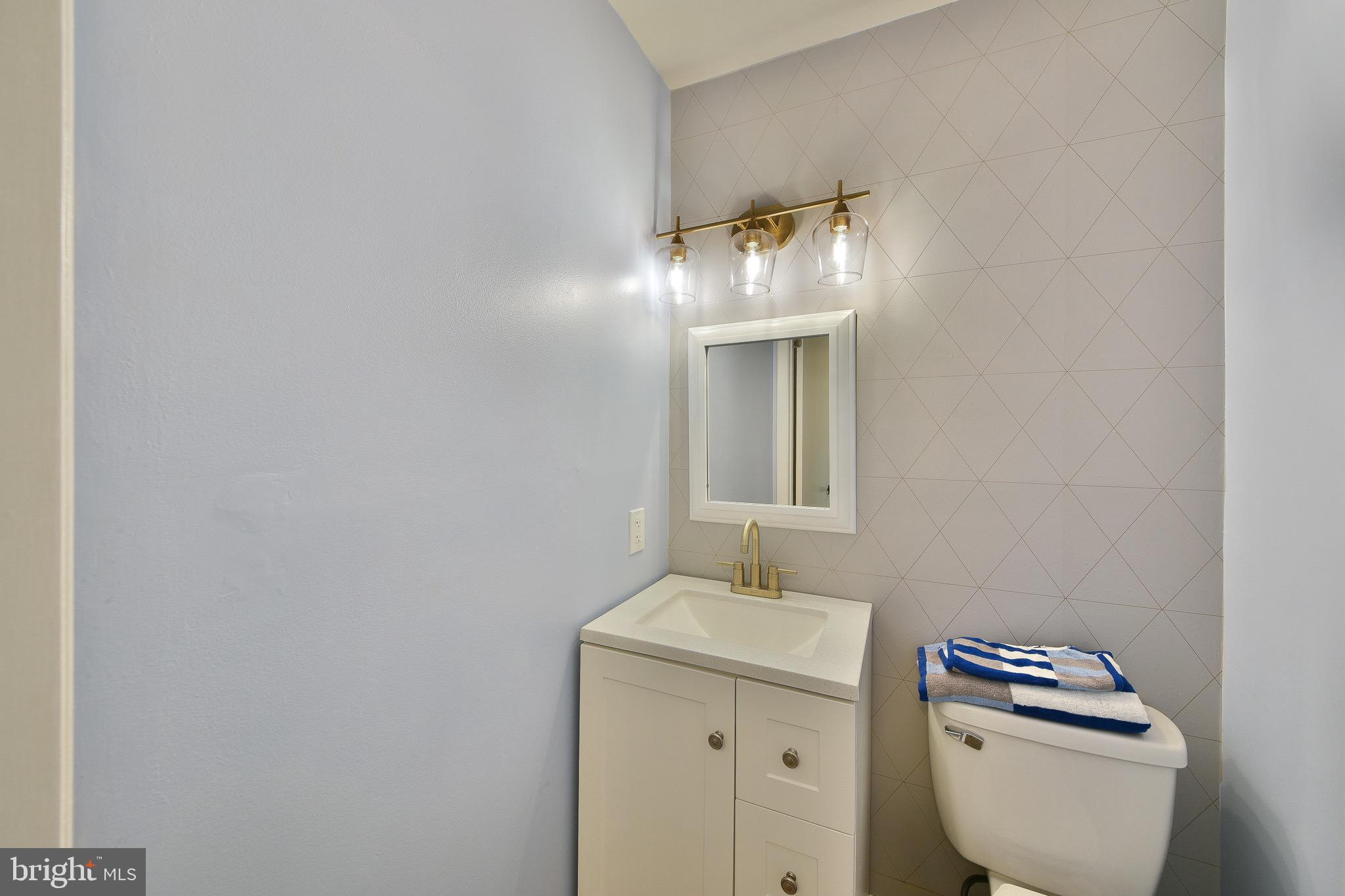17 Ruhl Drive Perkasie, PA 18944 - Photo 19 of 41 a bathroom with a toilet a sink and mirror