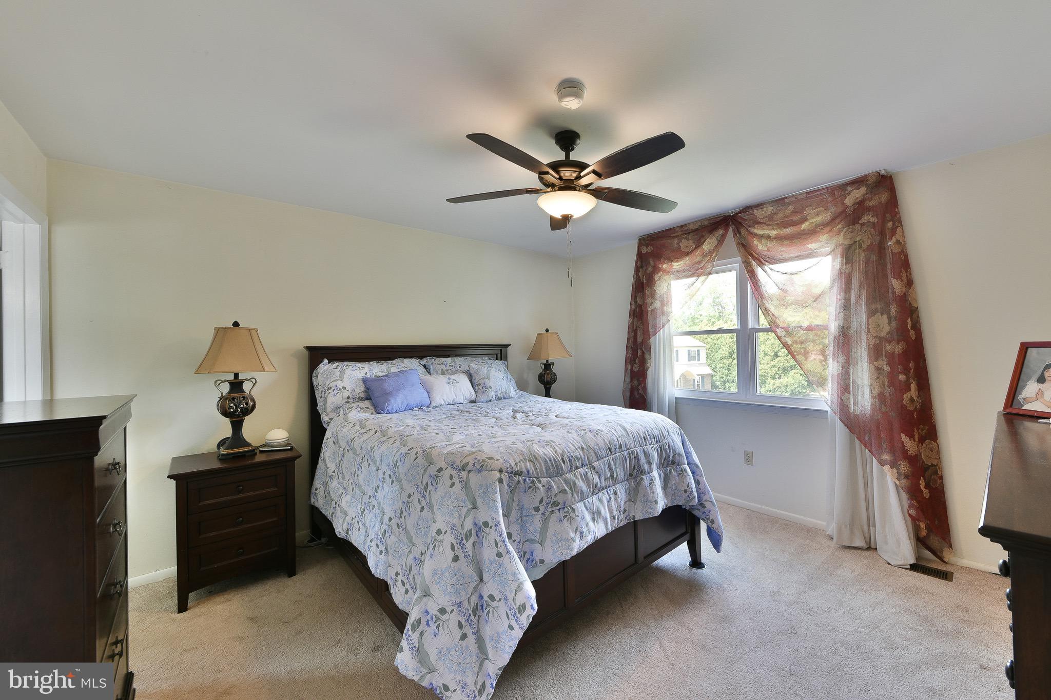 17 Ruhl Drive Perkasie, PA 18944 - Photo 21 of 41 a bedroom with a bed and a chandelier
