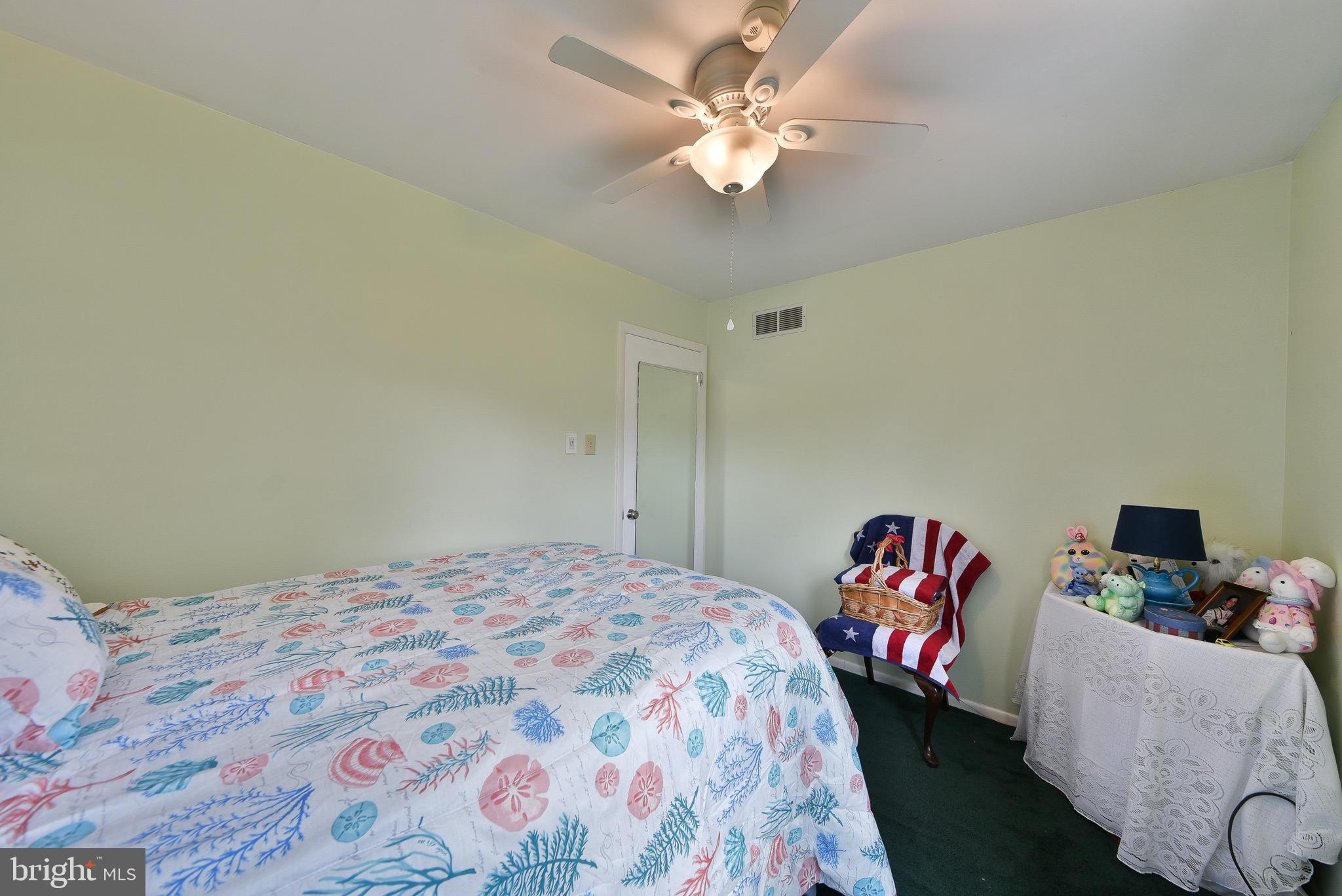17 Ruhl Drive Perkasie, PA 18944 - Photo 25 of 41 a bedroom with a bed and a chandelier
