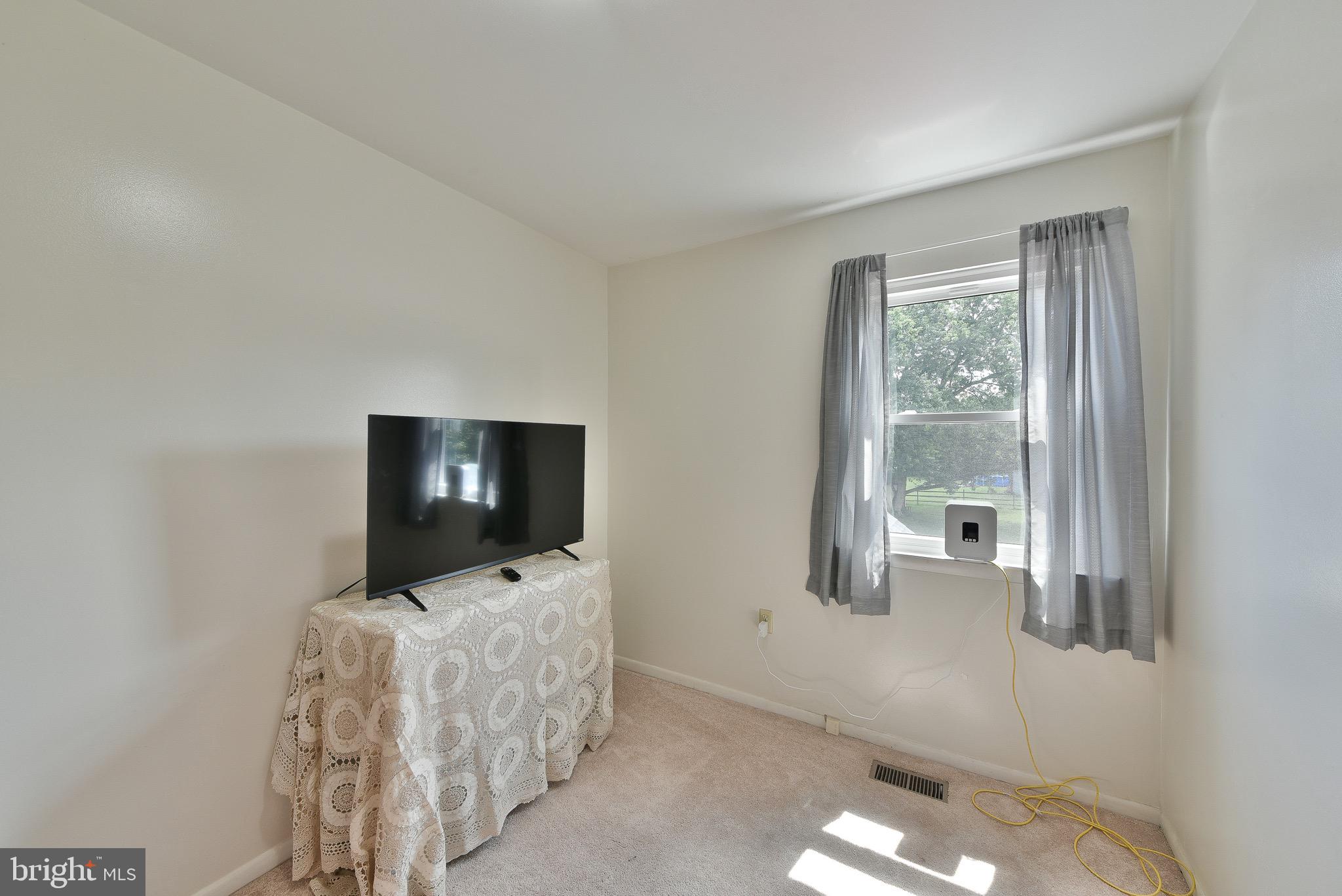 17 Ruhl Drive Perkasie, PA 18944 - Photo 27 of 41 a living room with furniture and a flat screen tv