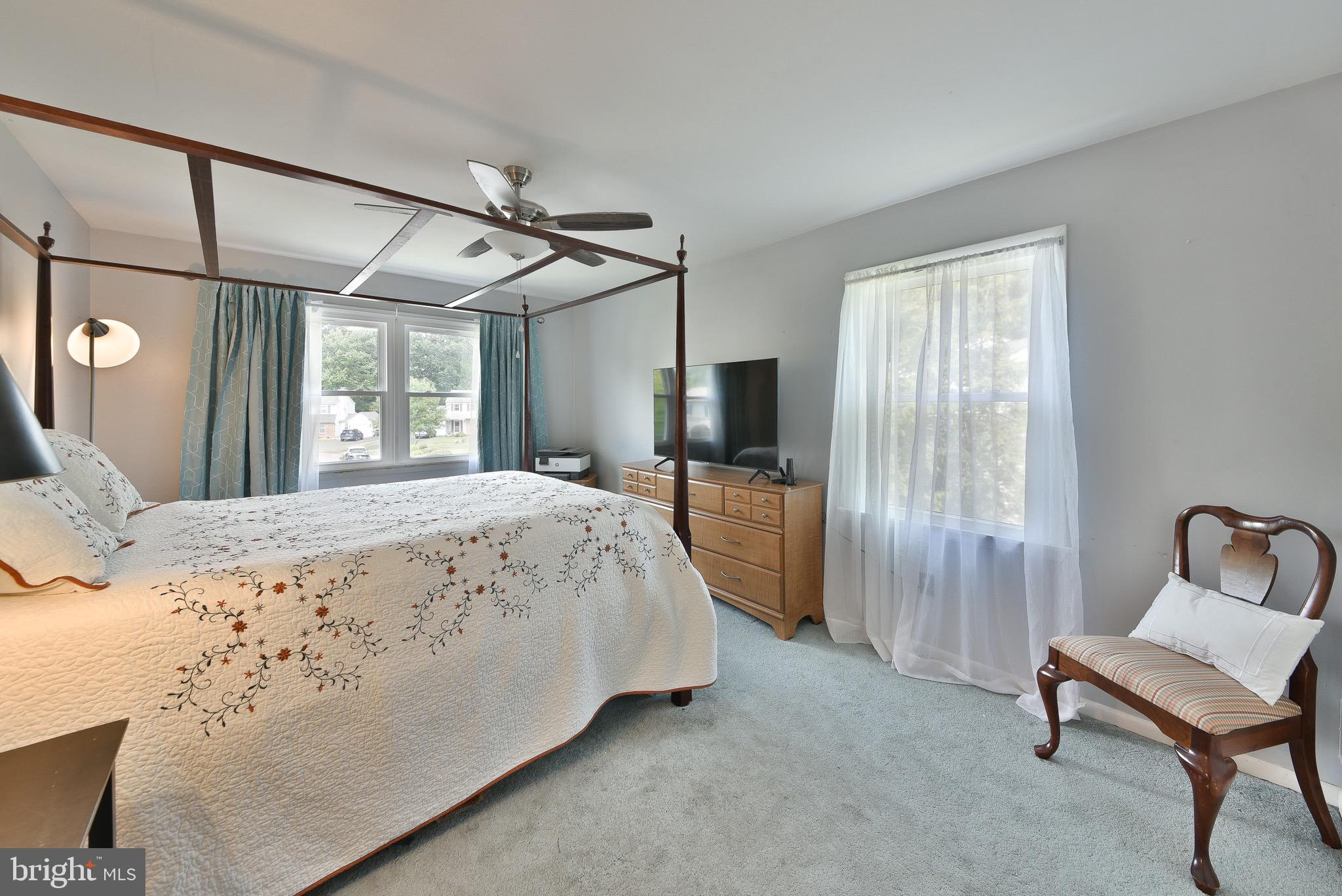 17 Ruhl Drive Perkasie, PA 18944 - Photo 31 of 41 a spacious bedroom with a bed and a chair