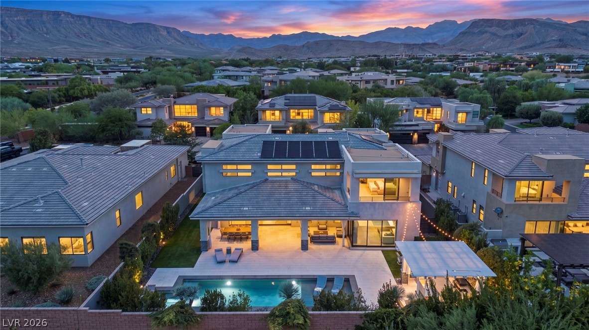 4208 Lapis Ridge Court Las Vegas, NV 89135 - Photo 57 of 61 Dramatic mountain vistas frame this contemporary desert estate with a pool and covered patio.