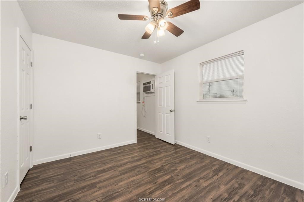 4309 College Main Street, Unit 6 Bryan, TX 77801 - Photo 6 of 8 a view of an empty room with wooden floor