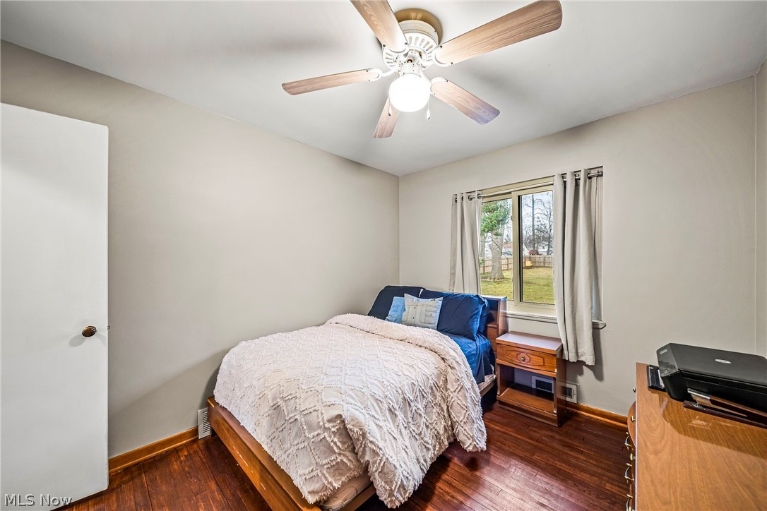 901 Lloyd Road Wickliffe, OH 44092 - Photo 21 of 40 Bedroom featuring dark wood-type flooring and ceiling fan