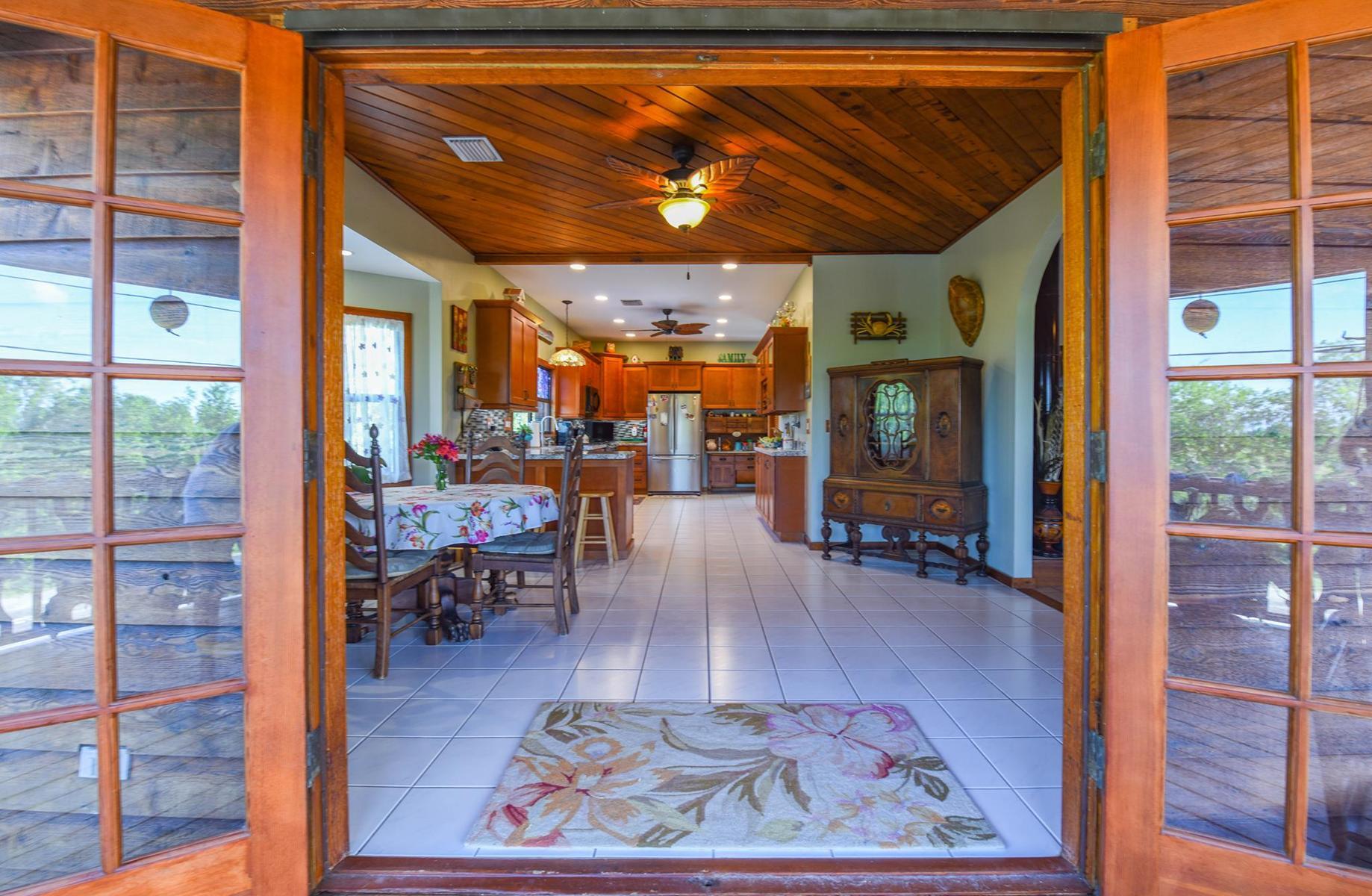 29430 Chickasaw Street Big Pine Key, FL 33043 - Photo 15 of 33 a room with lots of furniture and a rug