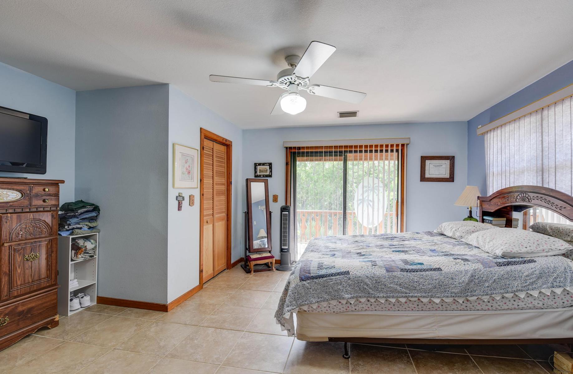 29430 Chickasaw Street Big Pine Key, FL 33043 - Photo 17 of 33 a bedroom with a bed and a television