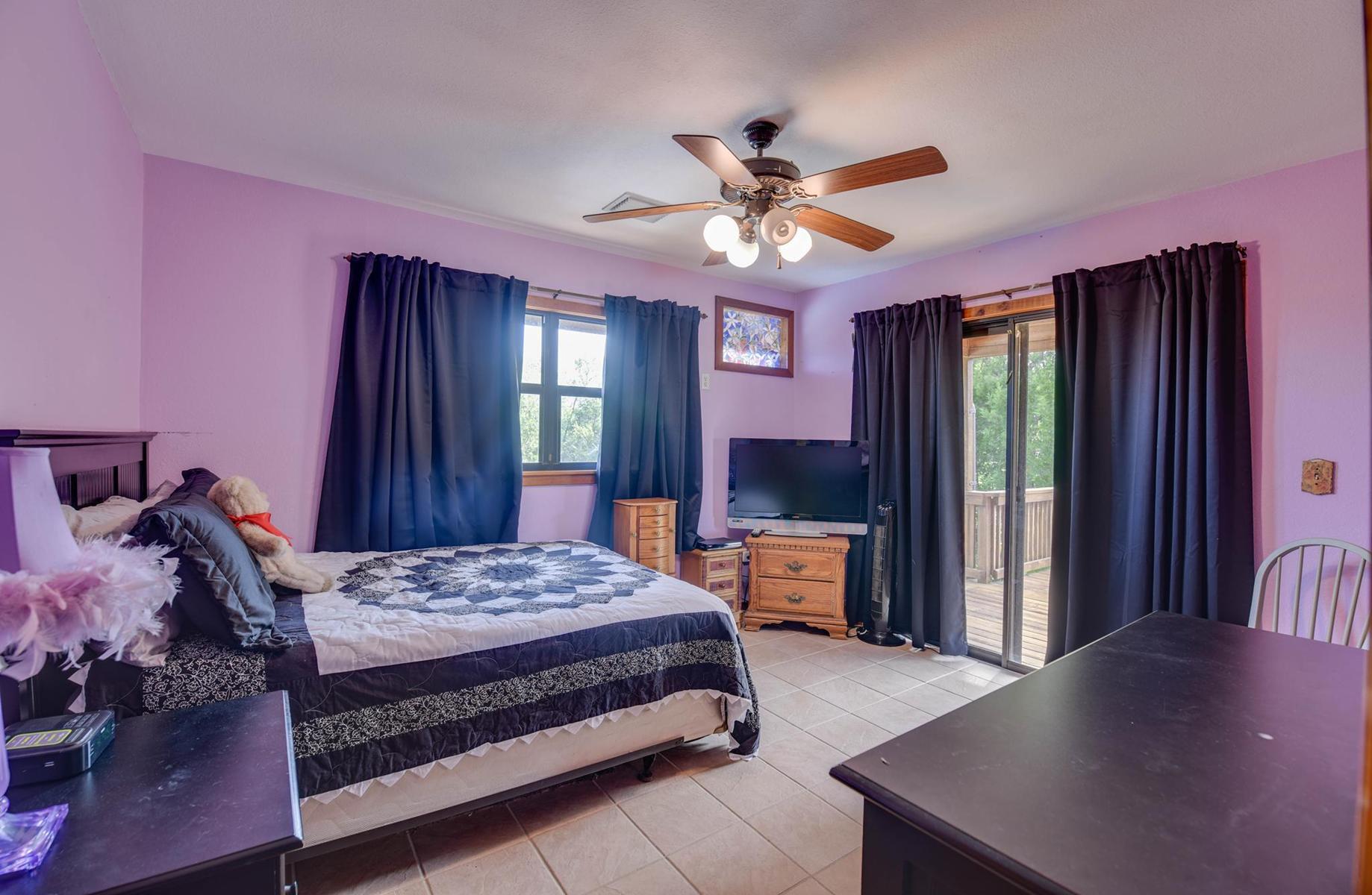 29430 Chickasaw Street Big Pine Key, FL 33043 - Photo 19 of 33 a bedroom with a bed a window and dresser