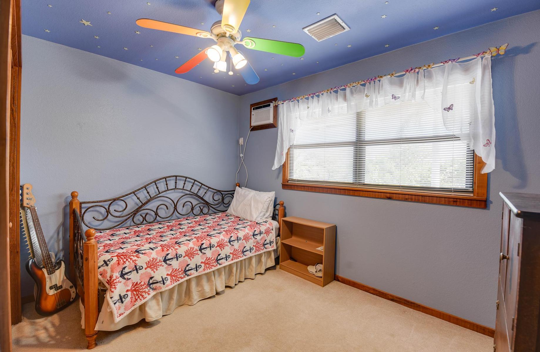 29430 Chickasaw Street Big Pine Key, FL 33043 - Photo 20 of 33 a bedroom with a bed and a window