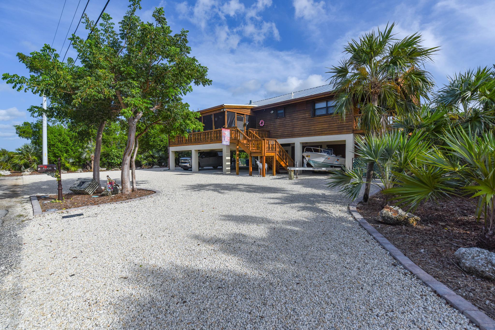 29430 Chickasaw Street Big Pine Key, FL 33043 - Photo 3 of 33 a view of a house with a patio