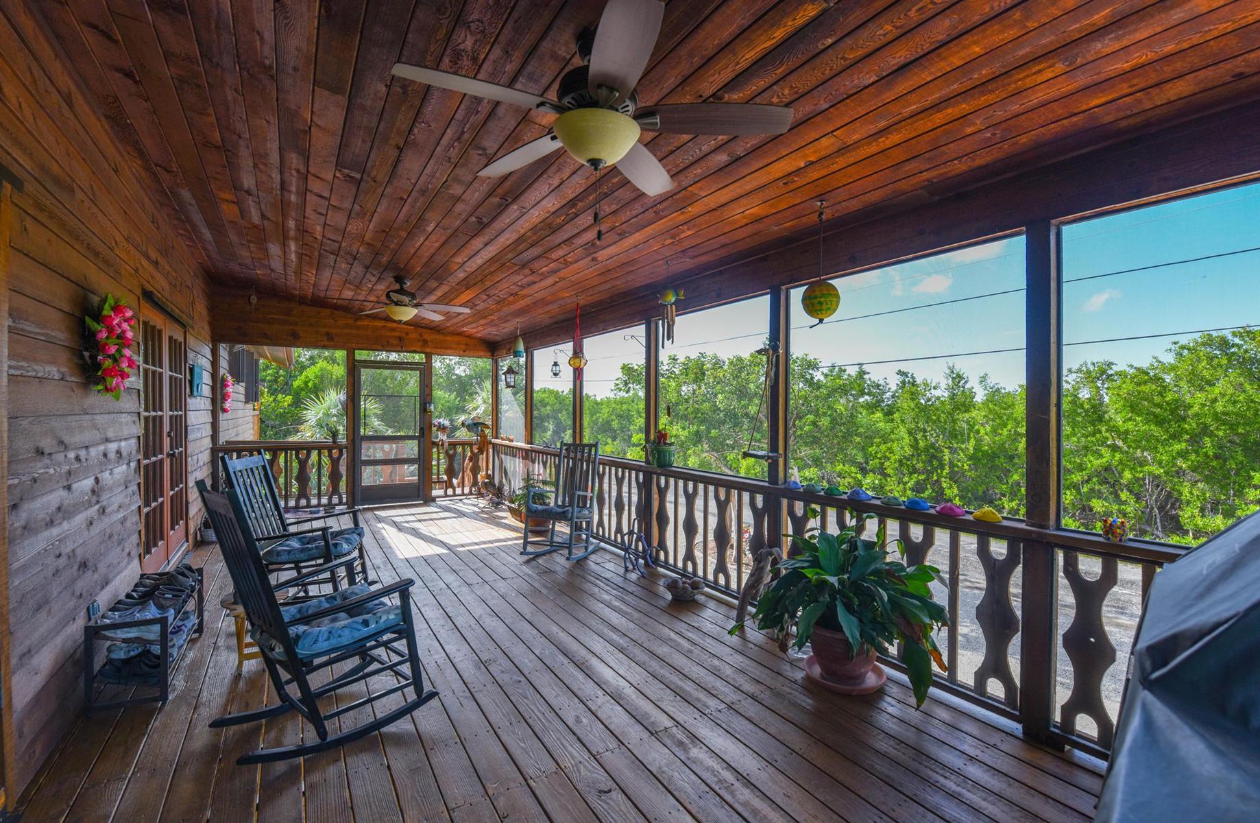 29430 Chickasaw Street Big Pine Key, FL 33043 - Photo 25 of 33 a view of balcony with wooden floor and outdoor seating