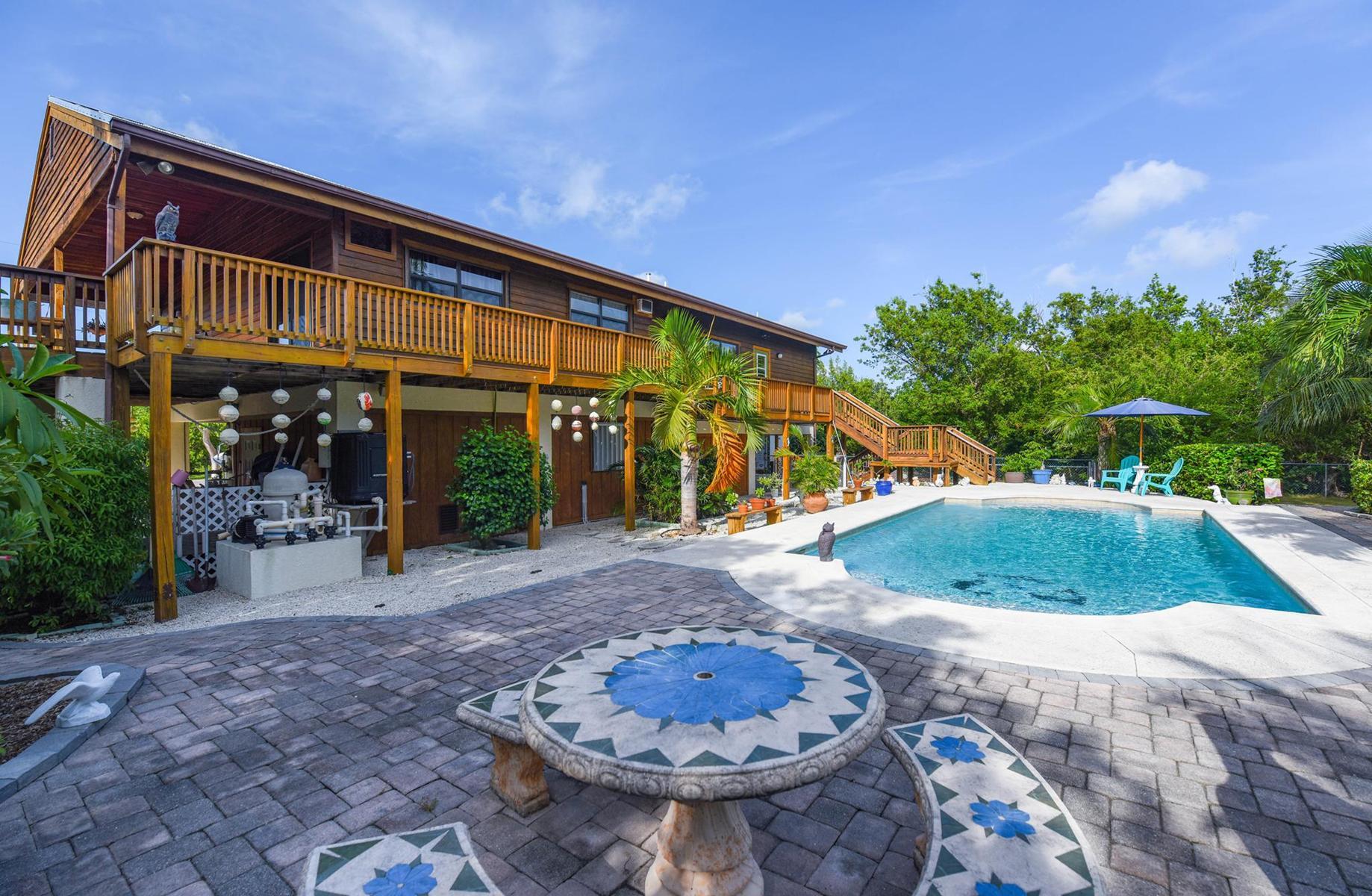 29430 Chickasaw Street Big Pine Key, FL 33043 - Photo 29 of 33 a view of a house with backyard and sitting area