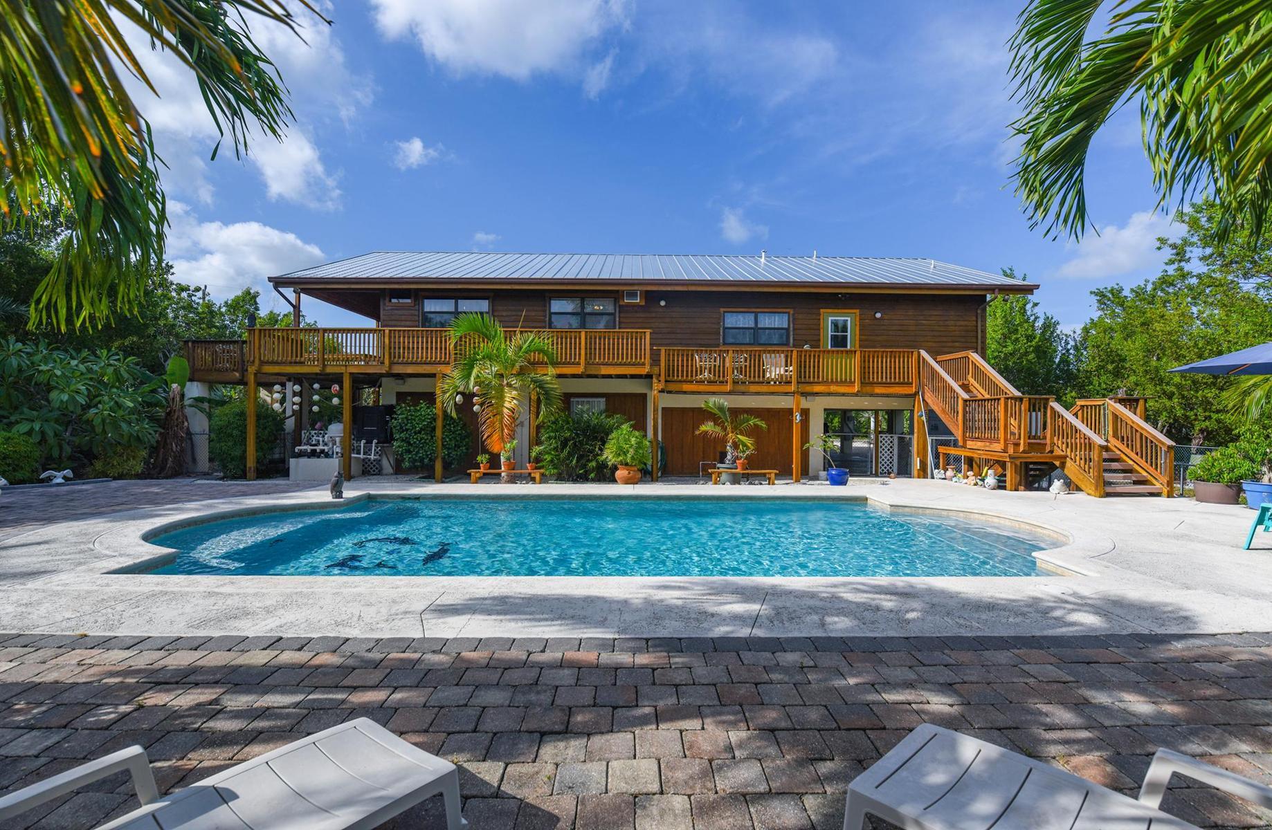 29430 Chickasaw Street Big Pine Key, FL 33043 - Photo 31 of 33 a view of a house with a yard