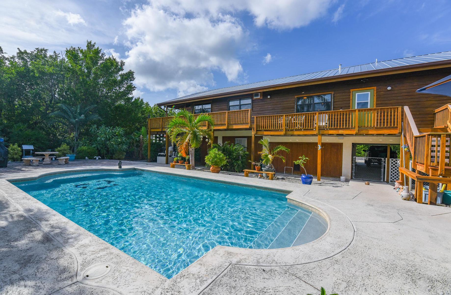 29430 Chickasaw Street Big Pine Key, FL 33043 - Photo 32 of 33 swimming pool view with a garden space